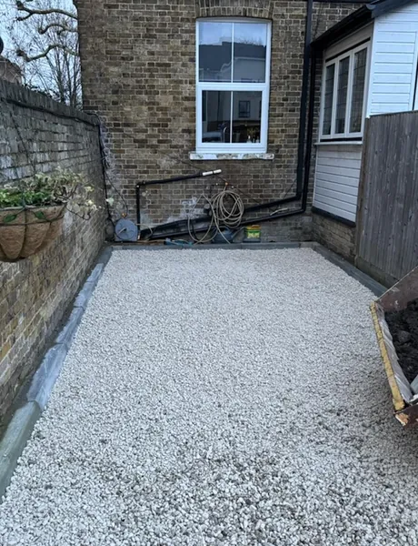 Gravelled courtyard with edging beside a period brick terrace – groundworks and paths for homes in Southsea