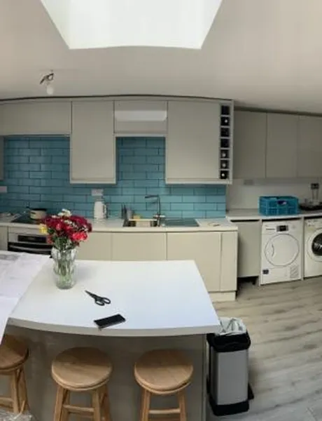 Fitted kitchen with roof lantern, blue metro tiles and breakfast bar – kitchen fitting for homes in Fareham