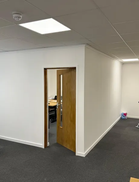 New office partition wall with a glazed timber door – commercial partitioning for homes in Fareham