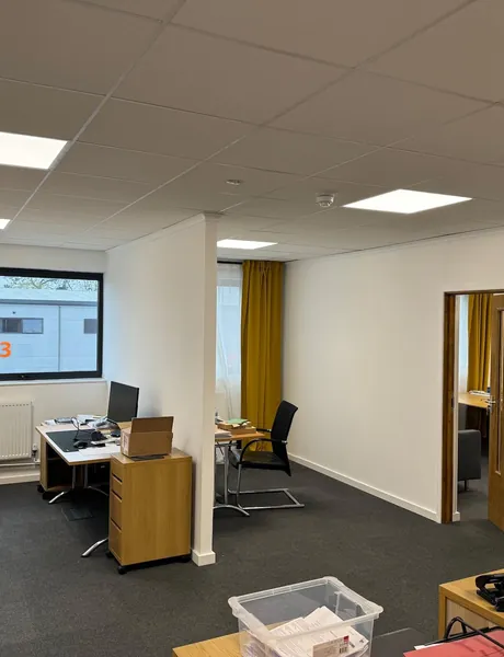 Refurbished open-plan office with ceiling tiles and LED panel lights – office refurbishment for homes in Portsmouth